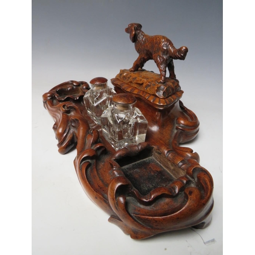 503 - A LATE 19TH / EARLY 20TH CENTURY MAHOGANY DESK TIDY, with pair of inkwells and carved wooden lid in ... 