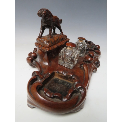 503 - A LATE 19TH / EARLY 20TH CENTURY MAHOGANY DESK TIDY, with pair of inkwells and carved wooden lid in ... 