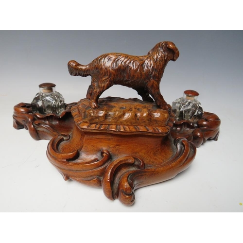 503 - A LATE 19TH / EARLY 20TH CENTURY MAHOGANY DESK TIDY, with pair of inkwells and carved wooden lid in ... 