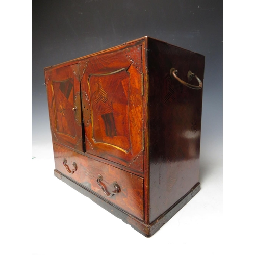 504 - A LATE 19TH / EARLY 20TH CENTURY CABINET WITH BRASS INLAY, twin brass handles, two doors opening to ... 