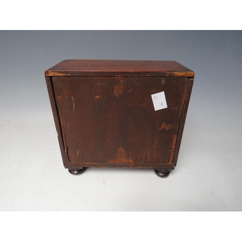 507 - A 19TH CENTURY MINIATURE MAHOGANY THREE DRAWER CHEST, raised on four turned feet, H 17 cm W 18 cm