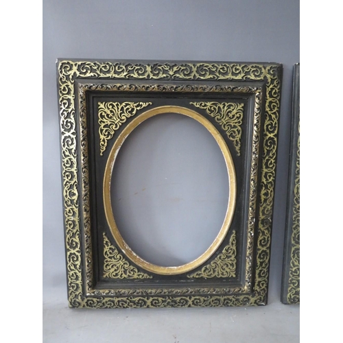 51 - A PAIR OF 19TH CENTURY EBONISED FRAMES, with gilt and oval inserts, frame W 8 cm, rebates 39 x 30 cm