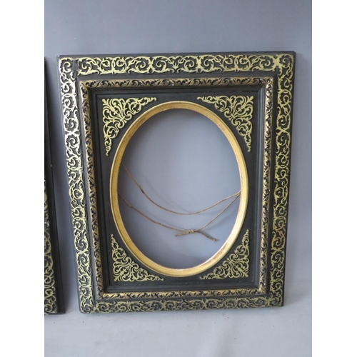 51 - A PAIR OF 19TH CENTURY EBONISED FRAMES, with gilt and oval inserts, frame W 8 cm, rebates 39 x 30 cm