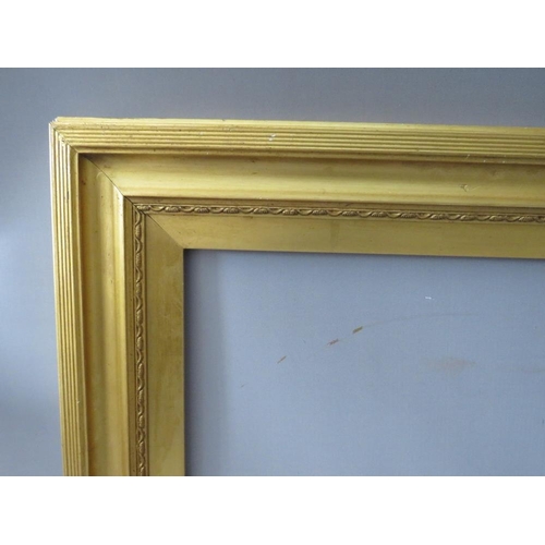 52 - A 19TH CENTURY GOLD FRAME, with decoration to inner edge and gold slip, frame W 6.5 cm, slip rebate ... 