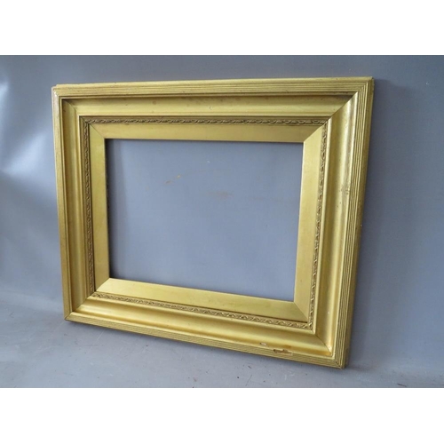 52 - A 19TH CENTURY GOLD FRAME, with decoration to inner edge and gold slip, frame W 6.5 cm, slip rebate ... 