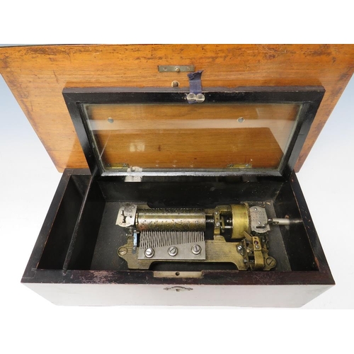 525 - A SWISS MUSIC BOX, the simulated rosewood case opening to reveal a small 31/2