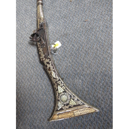 528 - A 19TH CENTURY EASTERN FLINTLOCK RIFLE, with bone inlay and white metal decoration, having metal ram... 