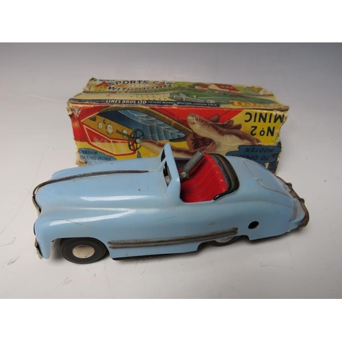 534 - A VINTAGE CLOCKWORK TINPLATE MINIC SPORTS CAR, with horn, box and key, L 17 cm, A/F