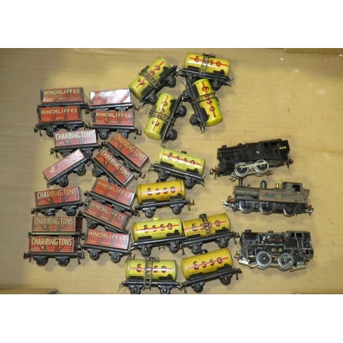 552 - A BOX CONTAINING TRIX MODEL RAILWAY TRUCKS, tankers and three various locomotives