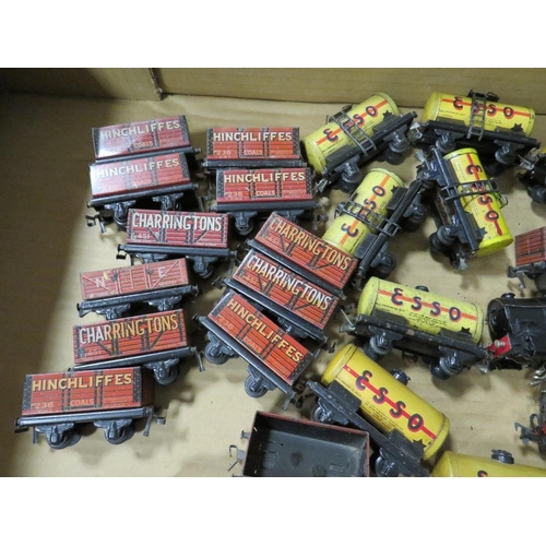 552 - A BOX CONTAINING TRIX MODEL RAILWAY TRUCKS, tankers and three various locomotives