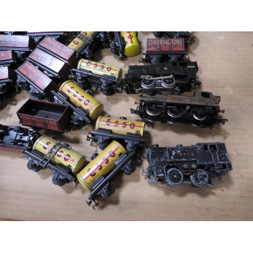 552 - A BOX CONTAINING TRIX MODEL RAILWAY TRUCKS, tankers and three various locomotives