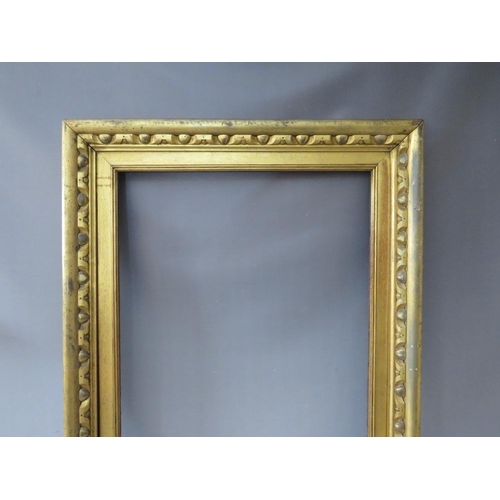 56 - A 19TH CENTURY GOLD FRAME, with carved wood inset and gold slip, frame W 8 cm, slip rebate 82 x 57 c... 