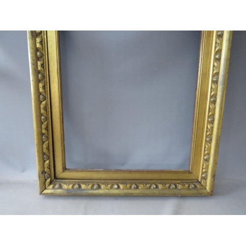 56 - A 19TH CENTURY GOLD FRAME, with carved wood inset and gold slip, frame W 8 cm, slip rebate 82 x 57 c... 