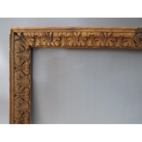 57 - A LATE 18TH / EARLY 19TH CENTURY CARVED WOODEN DECORATIVE FRAME, frame W 6 cm, rebate 98 x 77 cm