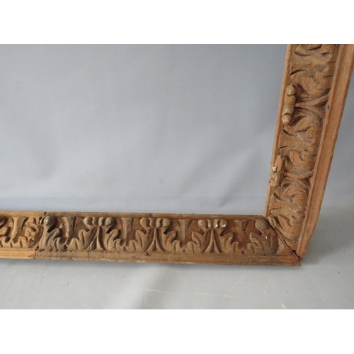 57 - A LATE 18TH / EARLY 19TH CENTURY CARVED WOODEN DECORATIVE FRAME, frame W 6 cm, rebate 98 x 77 cm