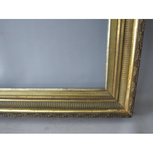 60 - A 19TH CENTURY GOLD FRAME, with reeded inner and acanthus leaf design to outer edge, with gold slip,... 