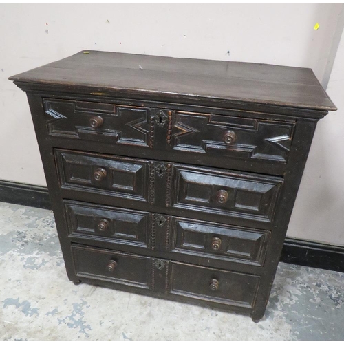 603 - A 17TH CENTURY OAK CHEST OF DRAWERS, having four graduated drawers, each with typical geometric and ... 