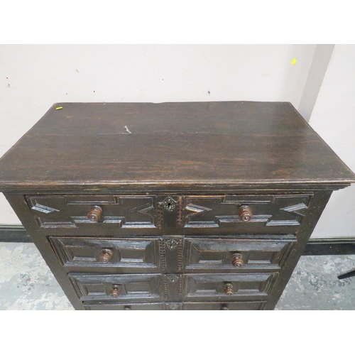 603 - A 17TH CENTURY OAK CHEST OF DRAWERS, having four graduated drawers, each with typical geometric and ... 