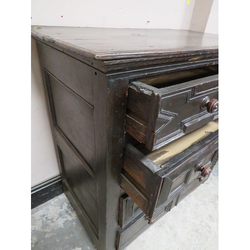 603 - A 17TH CENTURY OAK CHEST OF DRAWERS, having four graduated drawers, each with typical geometric and ... 