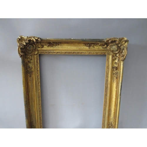 61 - A LATE 18TH / 19TH CENTURY GOLD FRAME, with ornate corners, frame W 8 cm, rebate 51 x 37 cm