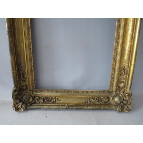 61 - A LATE 18TH / 19TH CENTURY GOLD FRAME, with ornate corners, frame W 8 cm, rebate 51 x 37 cm