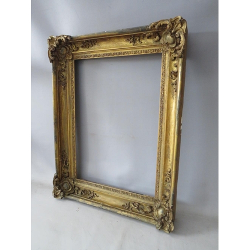 61 - A LATE 18TH / 19TH CENTURY GOLD FRAME, with ornate corners, frame W 8 cm, rebate 51 x 37 cm