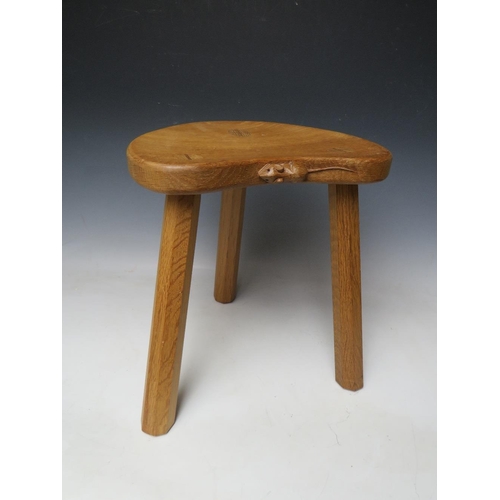 615 - A ROBERT MOUSEMAN THOMPSON THREE LEGGED STOOL, with typical carved mouse to front lip, H 36 cm