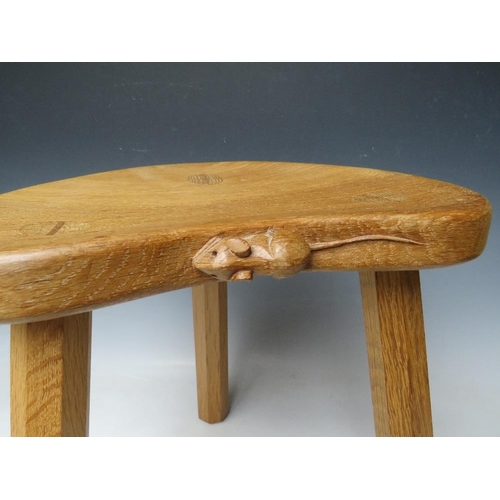 615 - A ROBERT MOUSEMAN THOMPSON THREE LEGGED STOOL, with typical carved mouse to front lip, H 36 cm