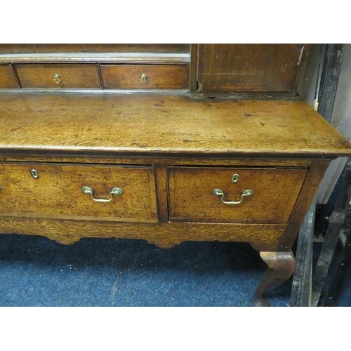 616 - A 19TH CENTURY OAK DRESSER, the open plate rack with two cupboards and five spice drawers, the lower... 