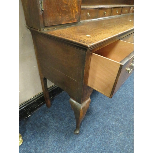 616 - A 19TH CENTURY OAK DRESSER, the open plate rack with two cupboards and five spice drawers, the lower... 