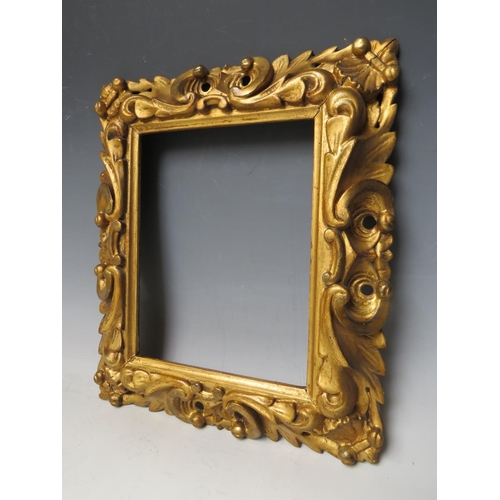 64 - AN 18TH CENTURY CARVED WOODEN PIERCED GOLD FRAME, frame W 7 cm, rebate 26 x 20 cm