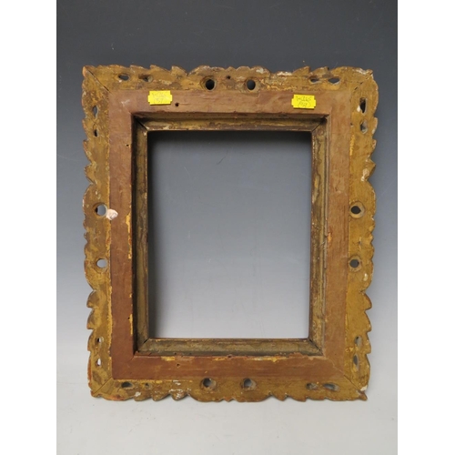 64 - AN 18TH CENTURY CARVED WOODEN PIERCED GOLD FRAME, frame W 7 cm, rebate 26 x 20 cm