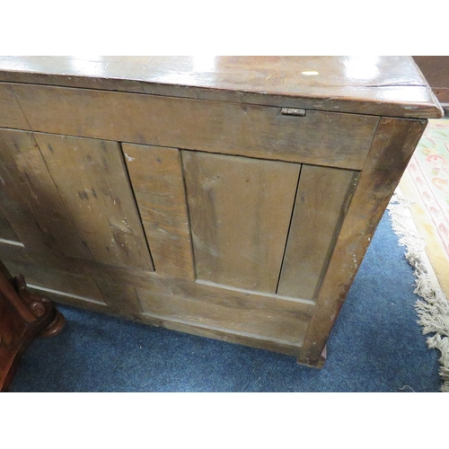 607 - AN OAK MULE CHEST, the hinged lid above a fielded triple panel front with two drawers below, raised ... 