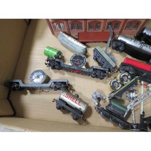 554 - A BOX CONTAINING AN ASSORTMENT OF MODEL RAILWAY CARRIAGES, signals, buildings and engines