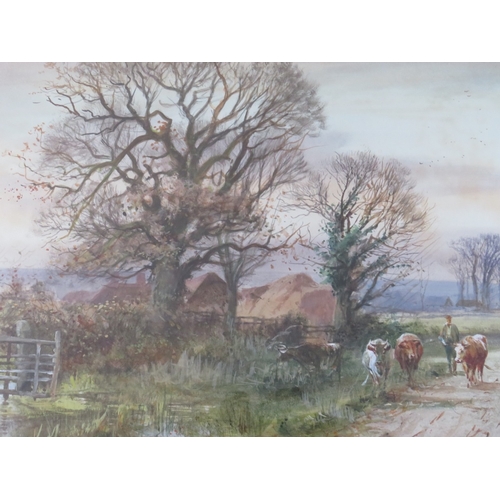 89 - HENRY CHARLES FOX (1860-1925). A rural wooded landscape with cattle and drover on lane, farmstead in... 