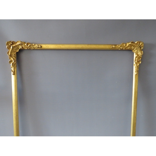 30 - A LATE 19TH / EARLY 20TH CENTURY DECORATIVE GOLD WATERCOLOUR FRAME, with corner embellishments, aver... 