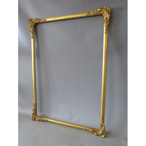 30 - A LATE 19TH / EARLY 20TH CENTURY DECORATIVE GOLD WATERCOLOUR FRAME, with corner embellishments, aver... 