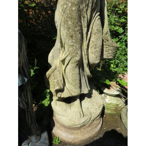 617 - A LARGE 20TH CENTURY STONE FEMALE GARDEN STATUE, with an urn in one hand and a basket of fruit in th... 