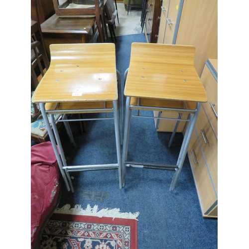 615 - A SET OF FOUR RETRO STYLE STACKING STOOLS (4)