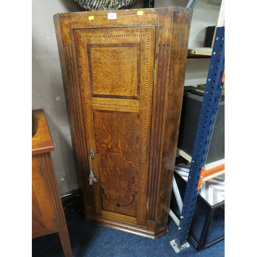 639 - A 19TH CENTURY OAK INLAID CORNER CUPBOARD