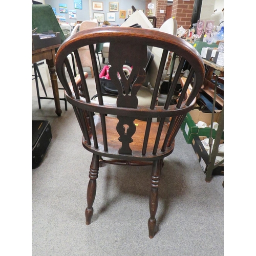 645 - A TRADITIONAL ANTIQUE ELM WINDSOR ARMCHAIR