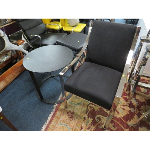 650 - A MODERN BLACK AND CHROMED ARMCHAIR WITH BLACK METAL TABLE (2)