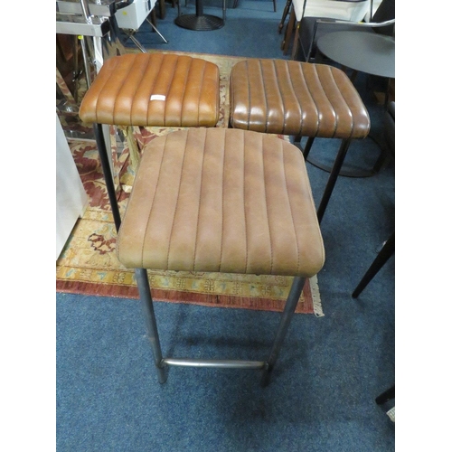 655 - THREE MODERN TAN LEATHER STOOLS