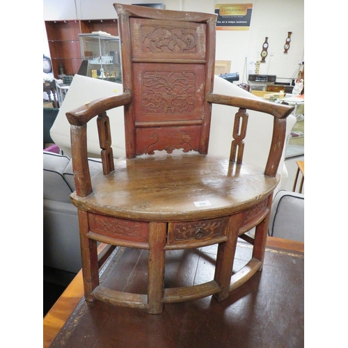 659 - AN UNUSUAL ORIENTAL STYLE HARDWOOD ARMCHAIR