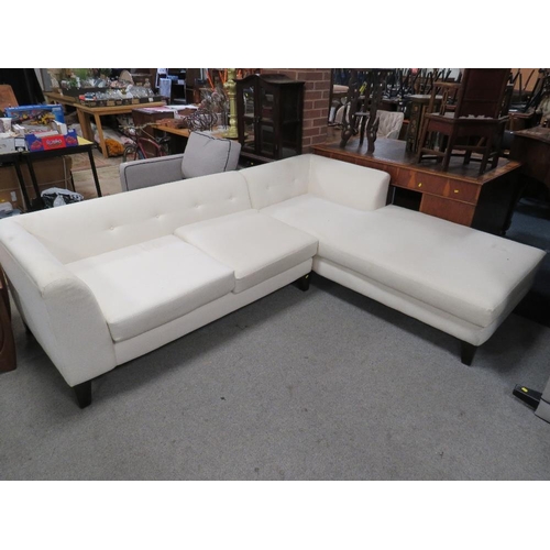 669 - A MODERN UPHOLSTERED CORNER SETTEE