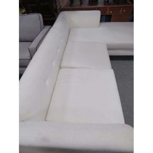 669 - A MODERN UPHOLSTERED CORNER SETTEE