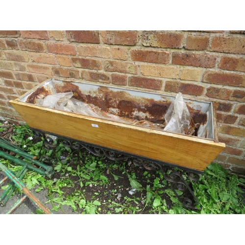 556 - A VINTAGE WOODEN TROUGH ON WROUGHT IRON BASE