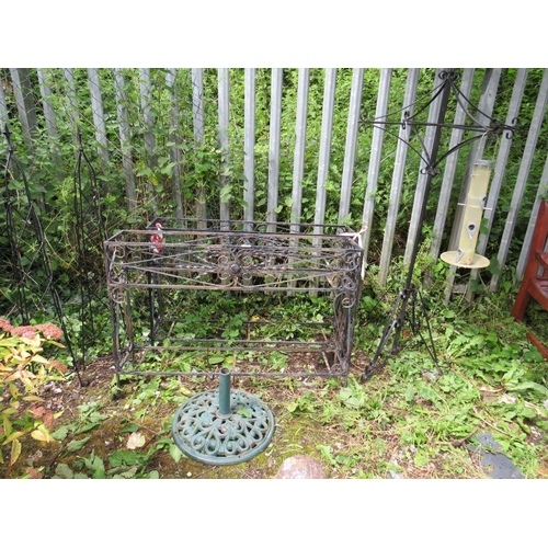 559 - TWO LARGE WROUGHT IRON PLANT STANDS, PARASOL BASE, BIRD FEEDER AND TWO OBELISKS (6)