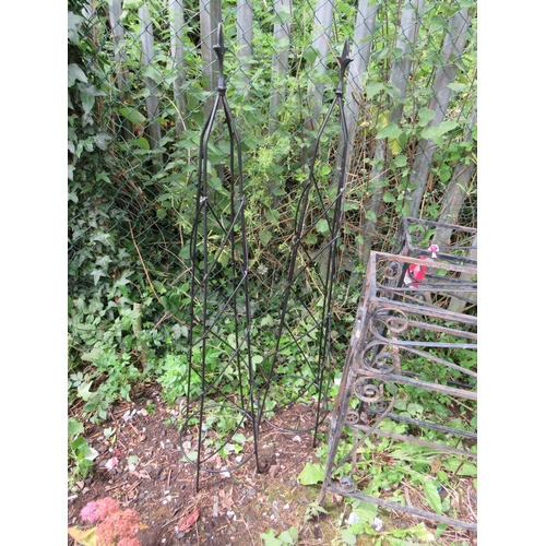 559 - TWO LARGE WROUGHT IRON PLANT STANDS, PARASOL BASE, BIRD FEEDER AND TWO OBELISKS (6)