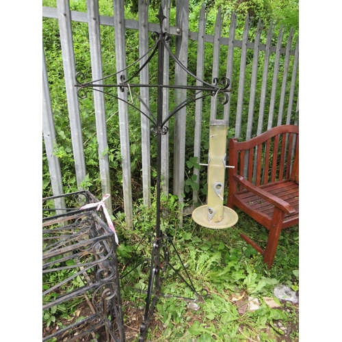 559 - TWO LARGE WROUGHT IRON PLANT STANDS, PARASOL BASE, BIRD FEEDER AND TWO OBELISKS (6)